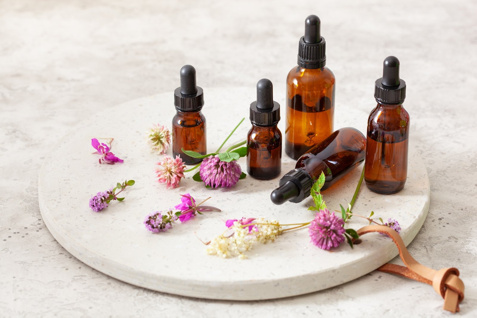 medical flowers herbs essential oils in bottles. alternative med